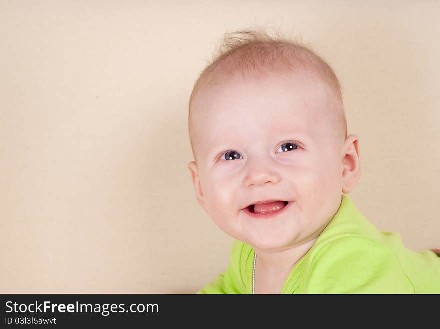 Baby Lying On Sofa