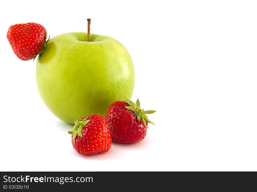 Green apple and three red strawberries isolated on white background. Green apple and three red strawberries isolated on white background