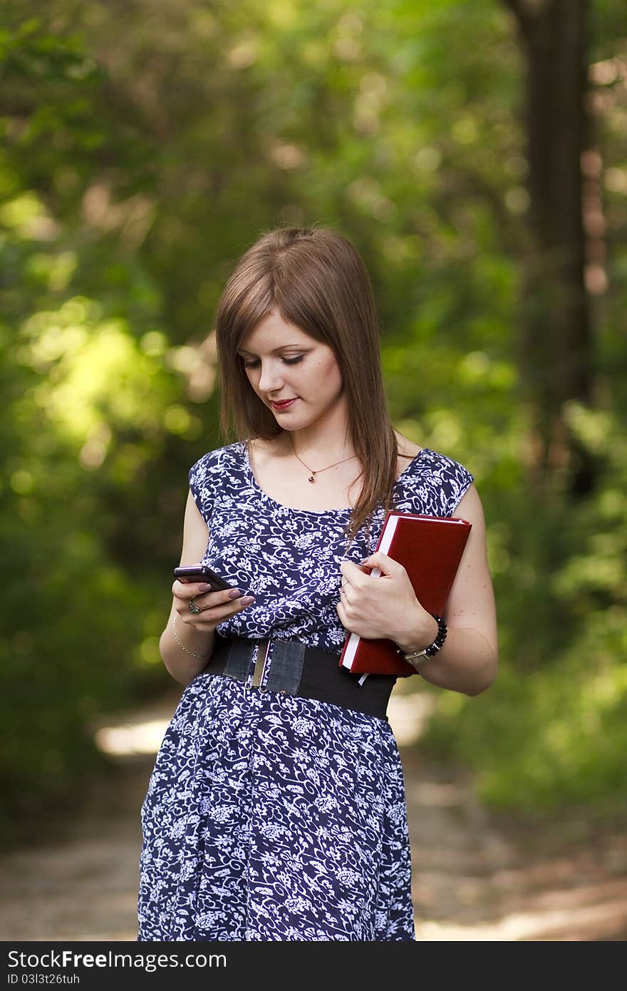 Cute girl talking on the phone with friend