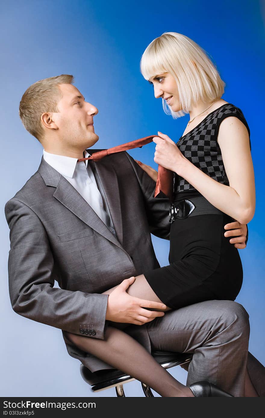 Beautiful young couple posing on a colored background. Beautiful young couple posing on a colored background