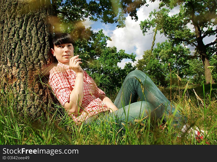 Beautiful young woman in forest