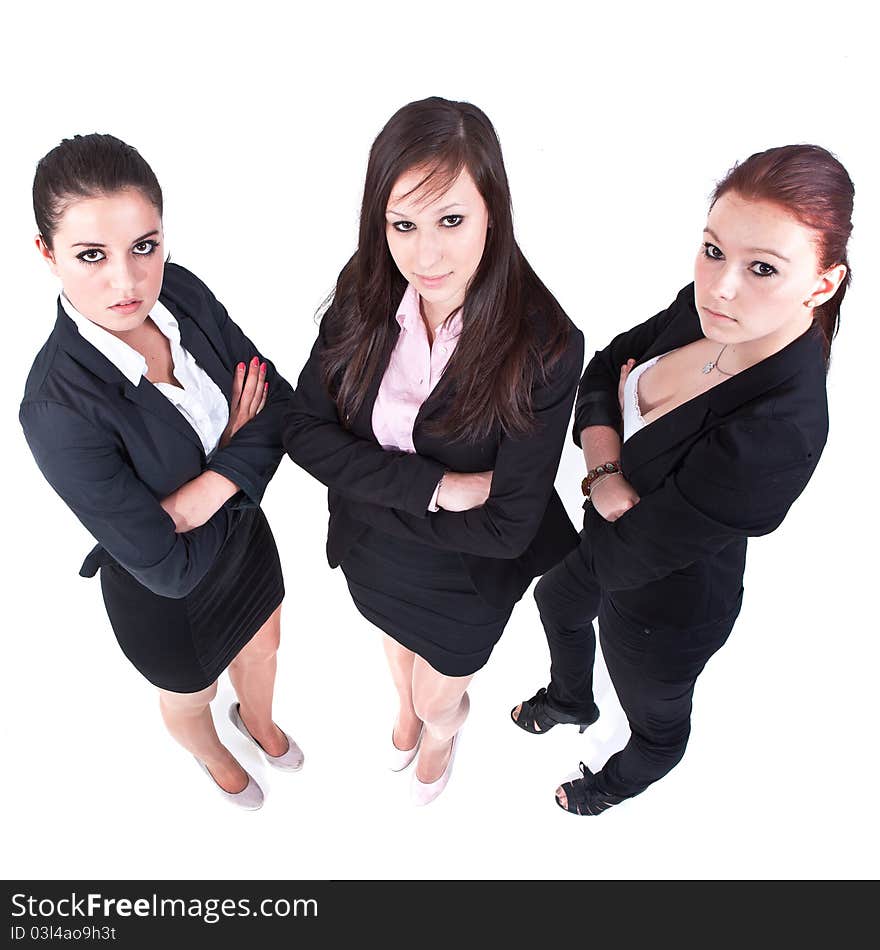 Three young businesswomen isolated over white. Modern, fresh and candid. Three young businesswomen isolated over white. Modern, fresh and candid.