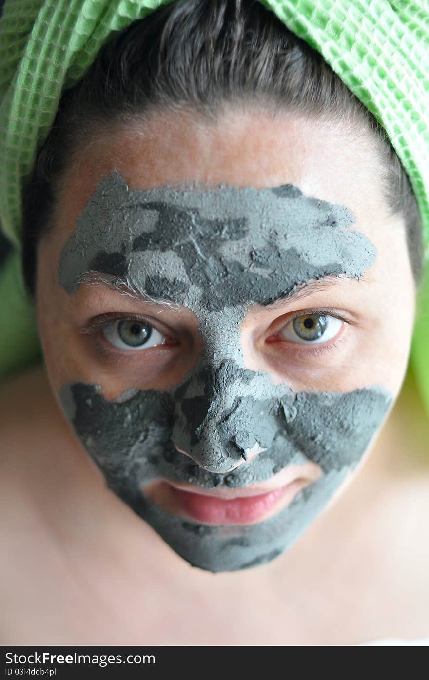 Close-up of a woman with a clay mask. Close-up of a woman with a clay mask