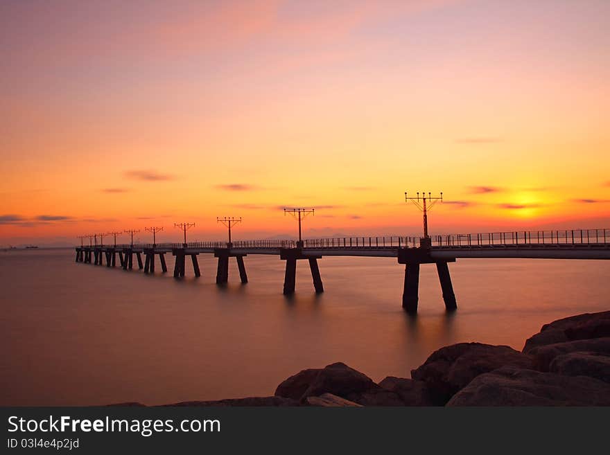 Sunset at coast of the sea