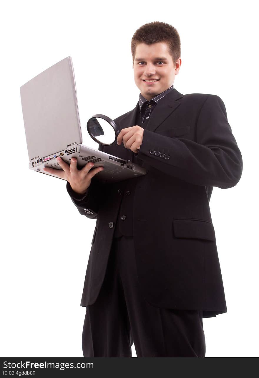 Man with a magnifying glass looking at laptop. Man with a magnifying glass looking at laptop