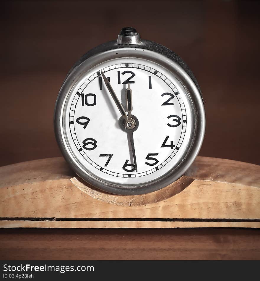 Dirty old table clock close up