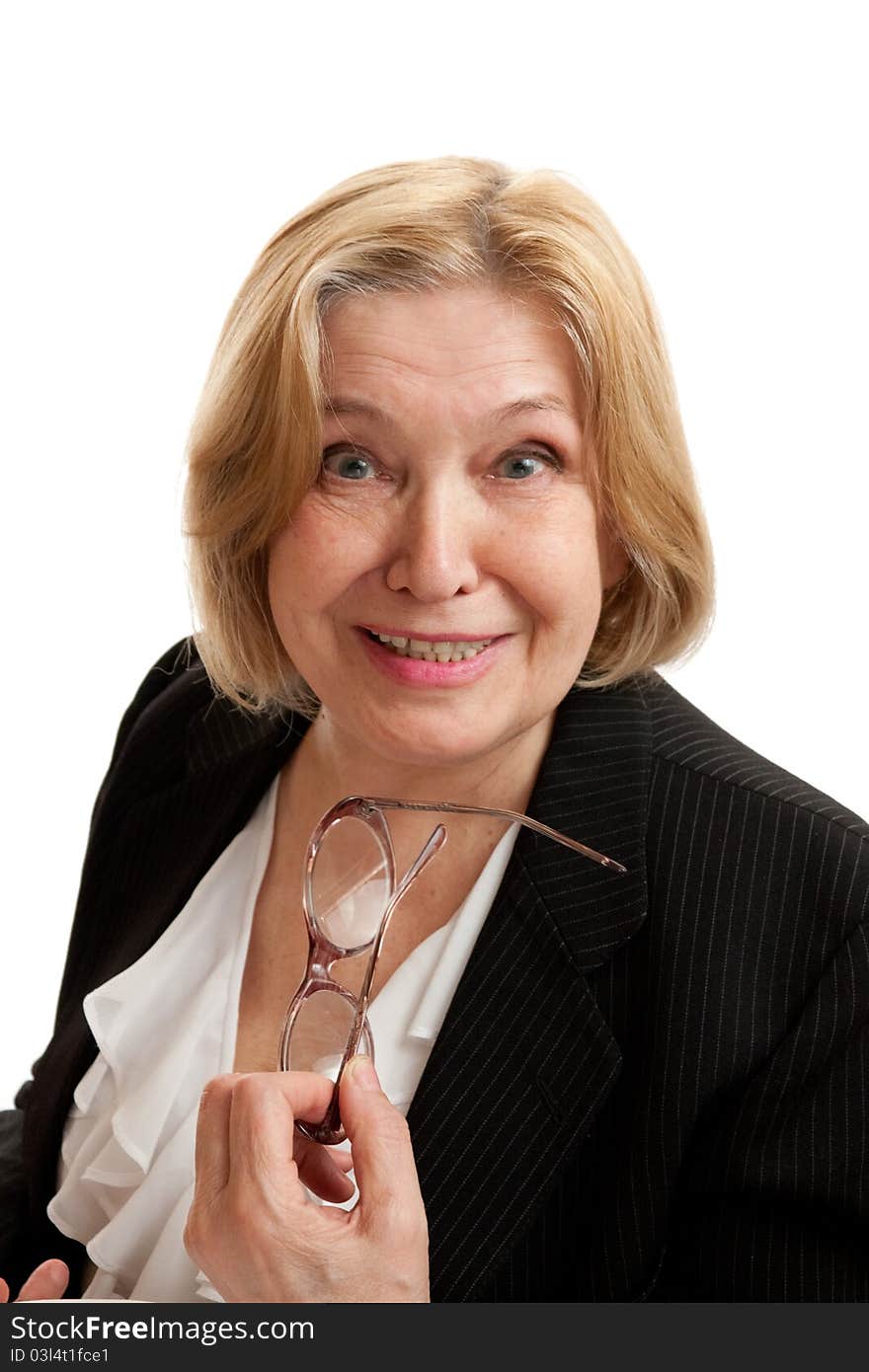 Senior Woman with glasses in black suite on white background. Blond hair. Shot in studio.