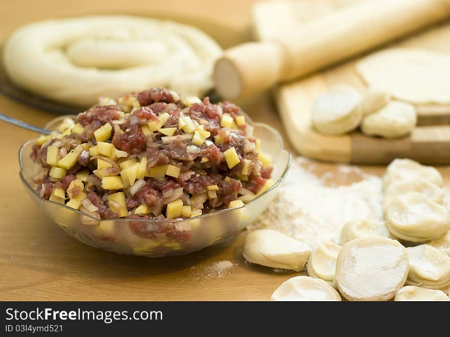 Dough with minced meat patties cooking Asian samsa