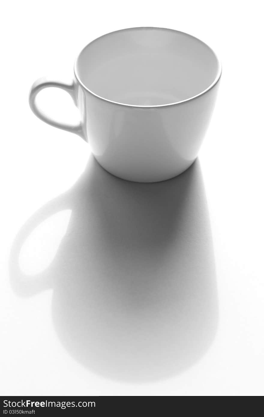 Empty cup in monochrome on gray paper. Empty cup in monochrome on gray paper