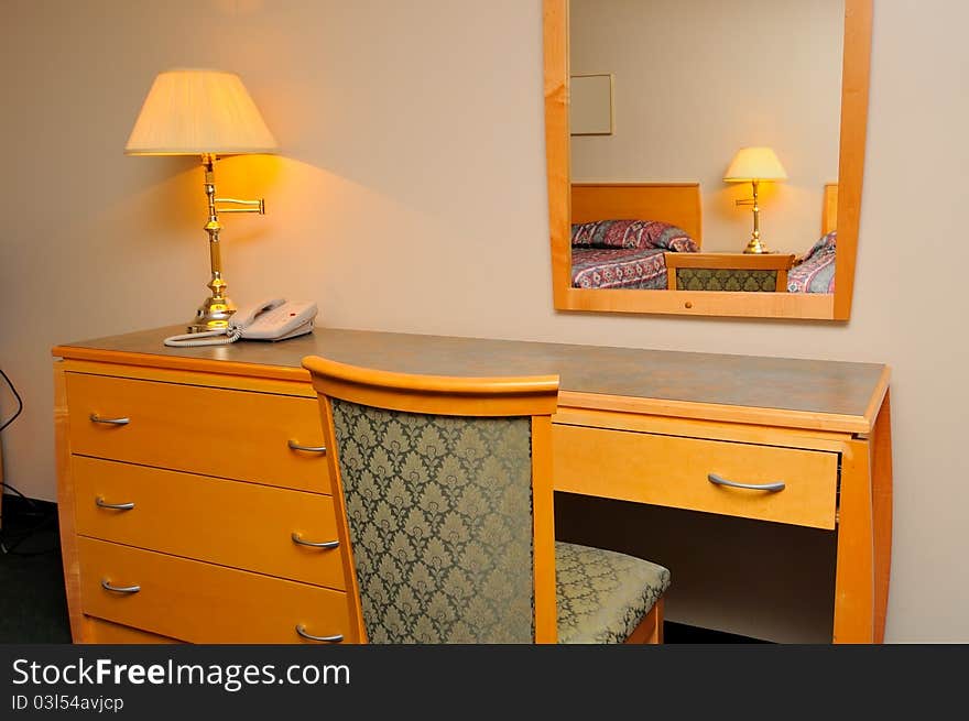 Generic dressing table and mirror in bedroom.