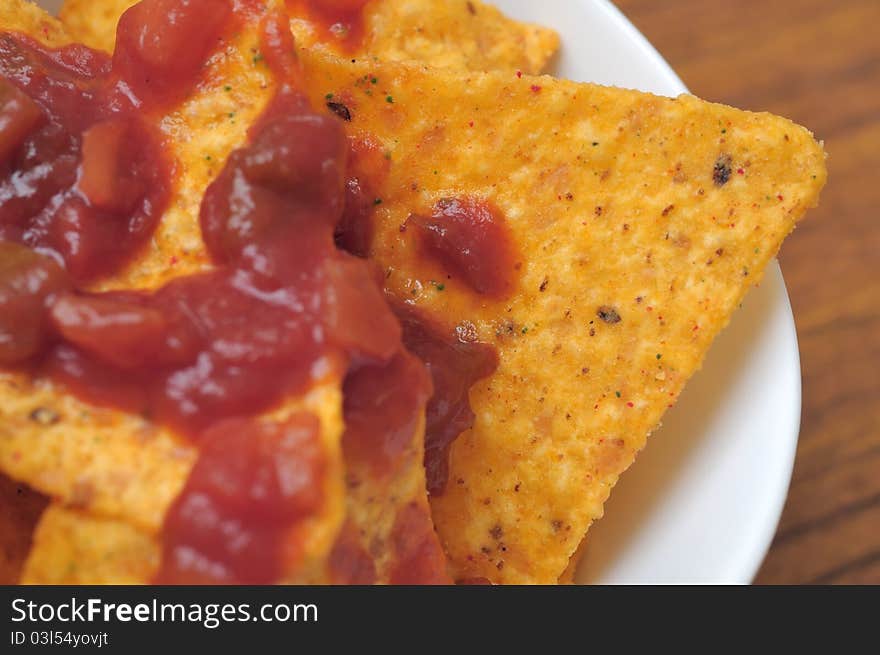 Macro shot of Italian corn snack with spicy tomato sauce dressing. Macro shot of Italian corn snack with spicy tomato sauce dressing.