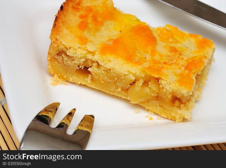 Single slice of sumptuous tart with golden crust. Single slice of sumptuous tart with golden crust.