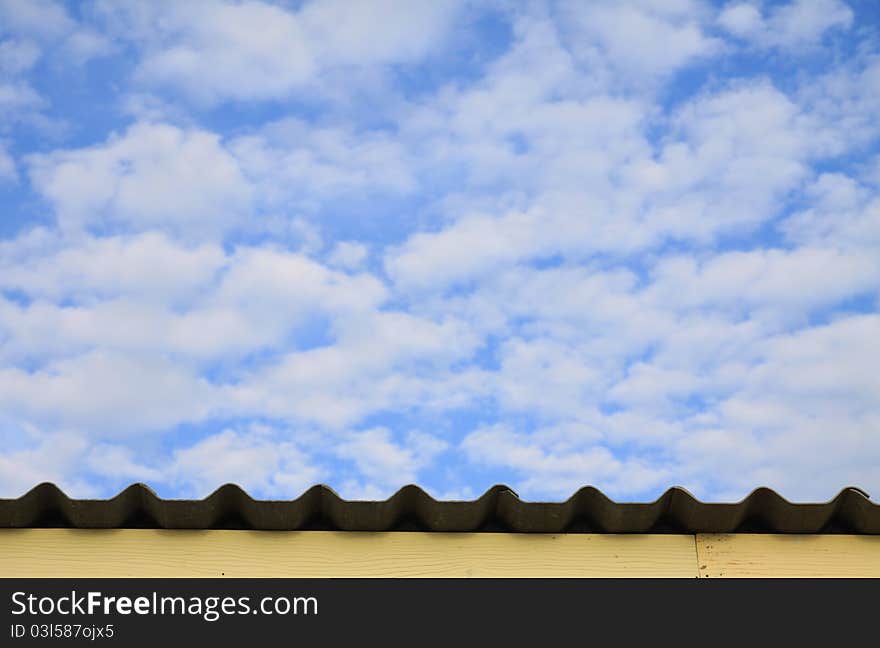 A deep blue sky with fluffy white clouds