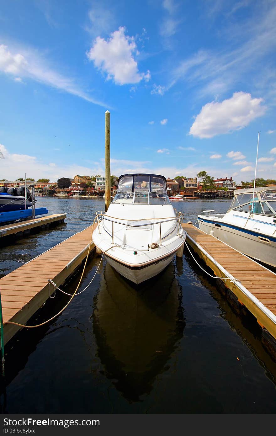 Motor boat docked in the marina.