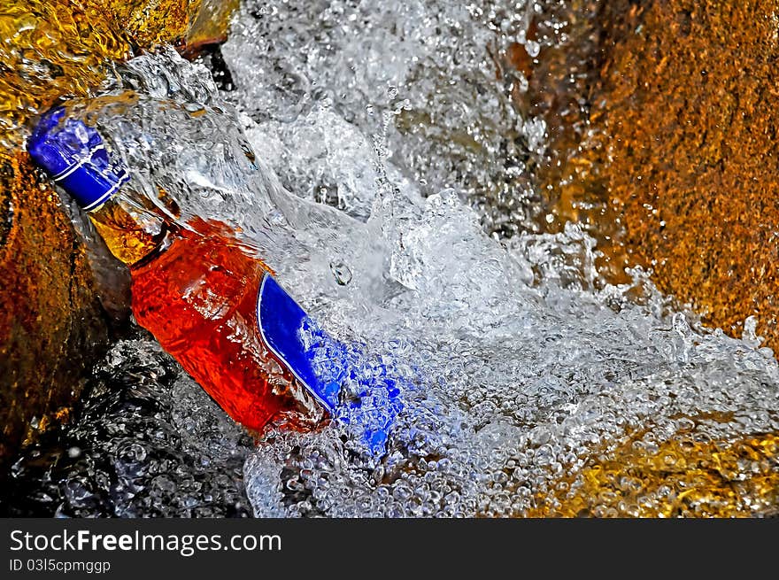 Whisky stand in waterfall it coolling from water.