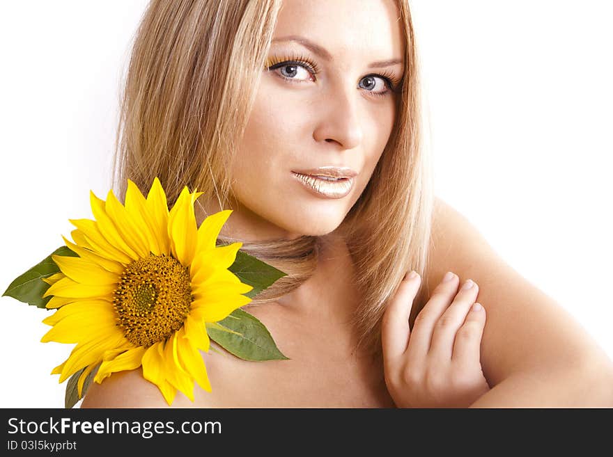 Portrait of young beautiful blond girl with stylish make-up and sunflower. Portrait of young beautiful blond girl with stylish make-up and sunflower