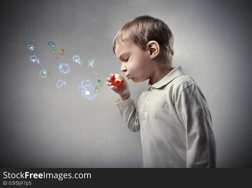 Child playing with soap bubbles