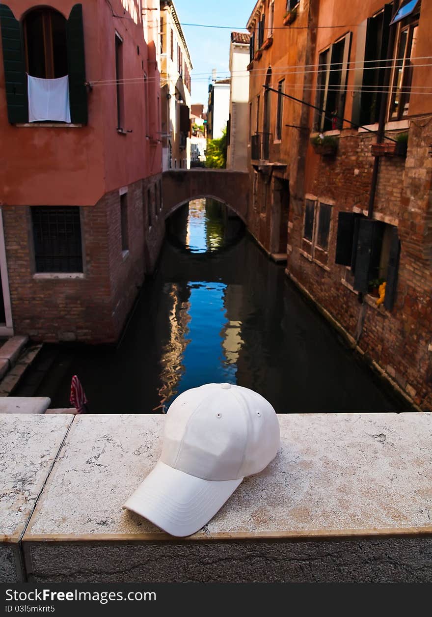 A white Cap on the Bridge the Grand Canal, Venice, Italy. A white Cap on the Bridge the Grand Canal, Venice, Italy