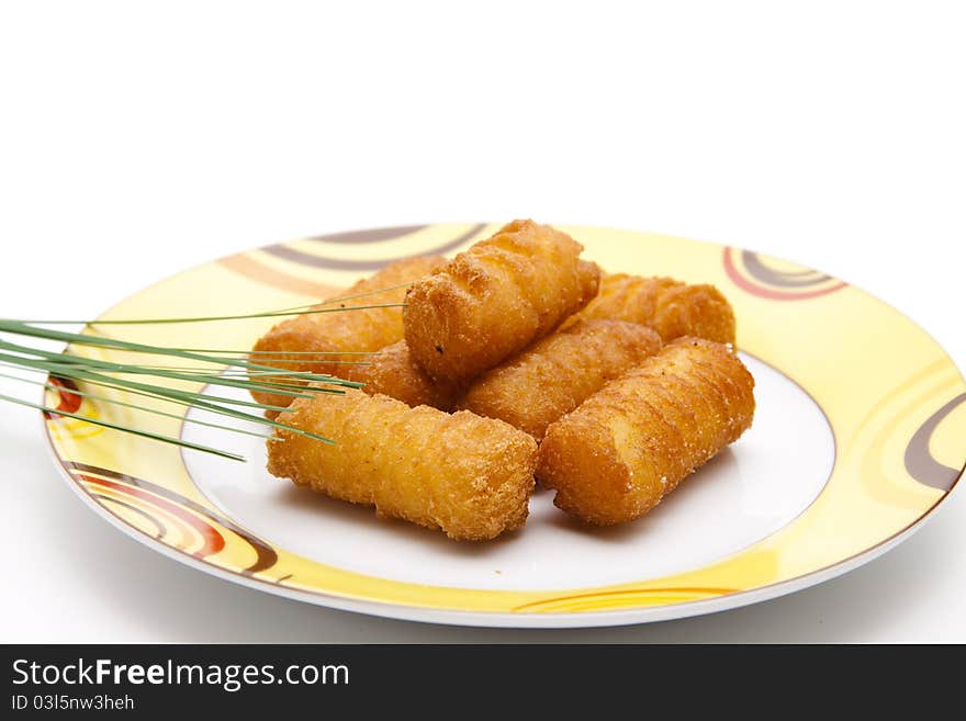 Croquettes with plate onto white background. Croquettes with plate onto white background