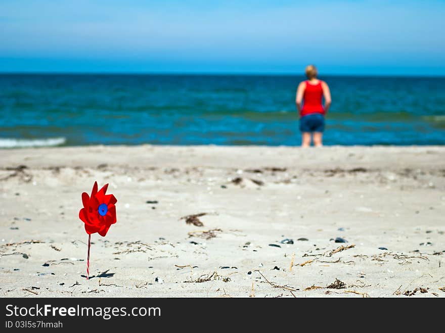 Red Wind Turbine On The Beach