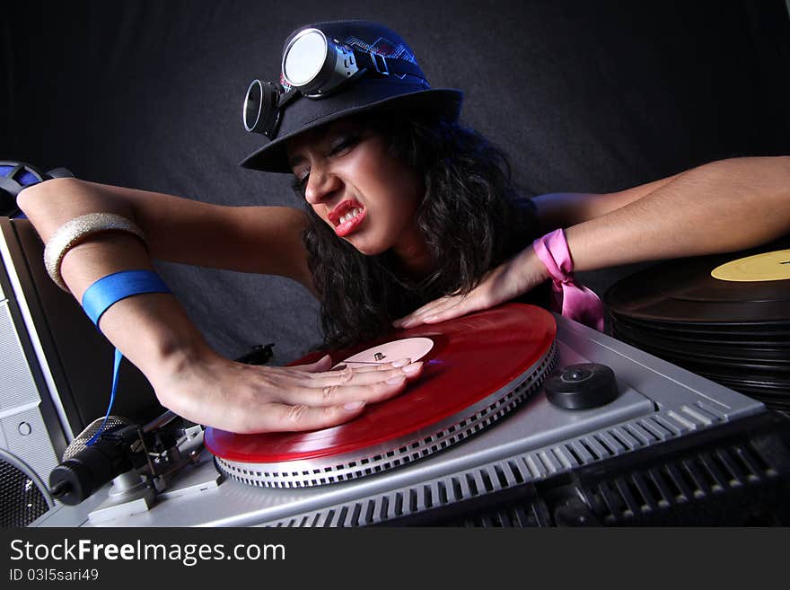 Cool DJ in action in hat