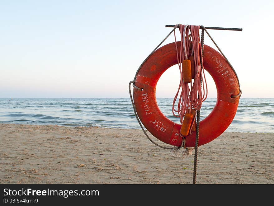 Old lifebuoy against the sea