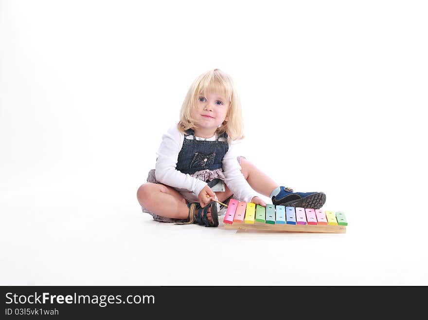 Girl playing a musical toy