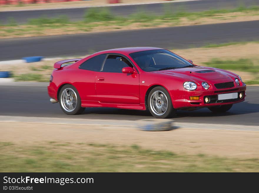 Fast red car in a race. Fast red car in a race