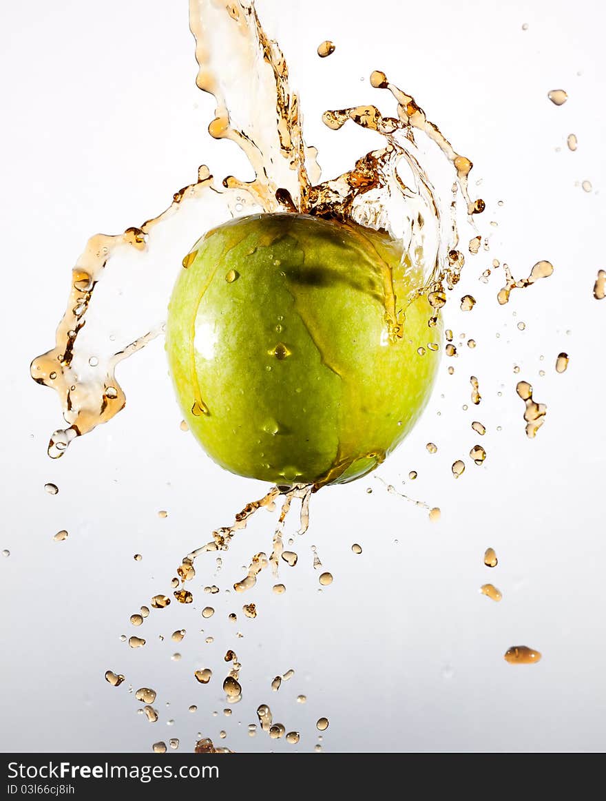 Splash apple. CocaCola and splashing water