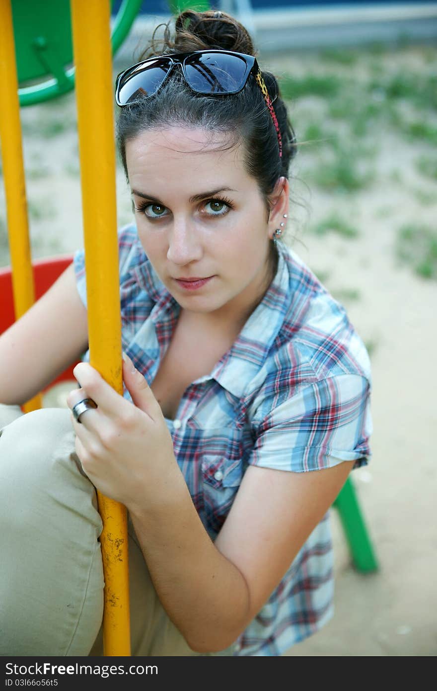 The beautiful girl on a swing