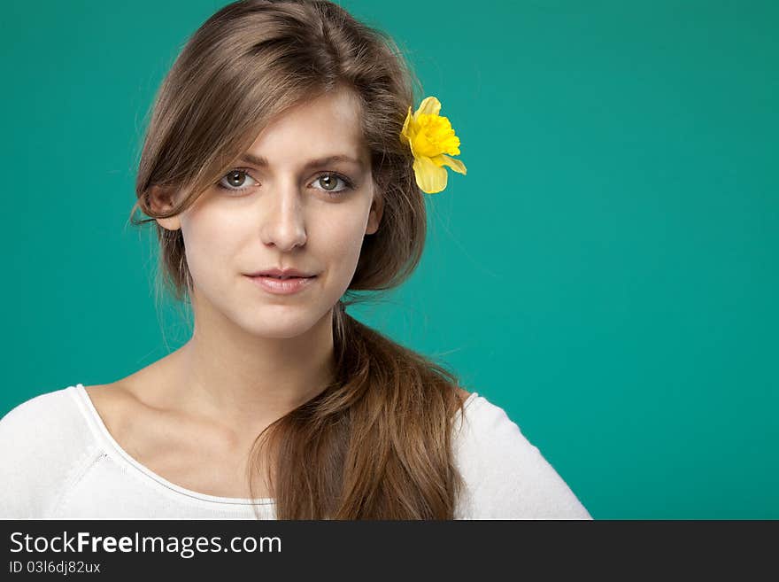 Portrait Of Female With Flower Over The Ear