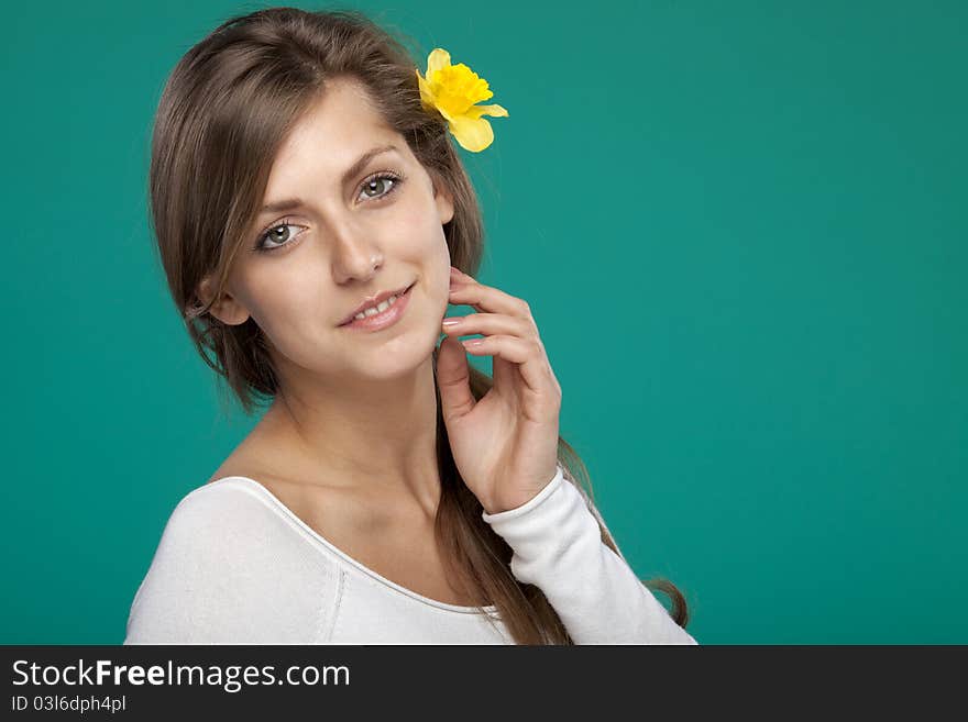 Portrait Of Female With Flower Over The Ear