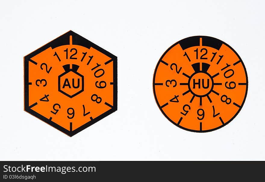 A orange german TUEV-seal and AU-badge