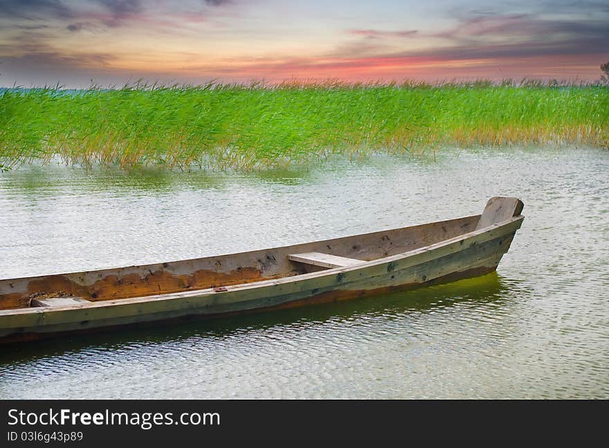 Boat at coast against a coming nearer thunder-storm