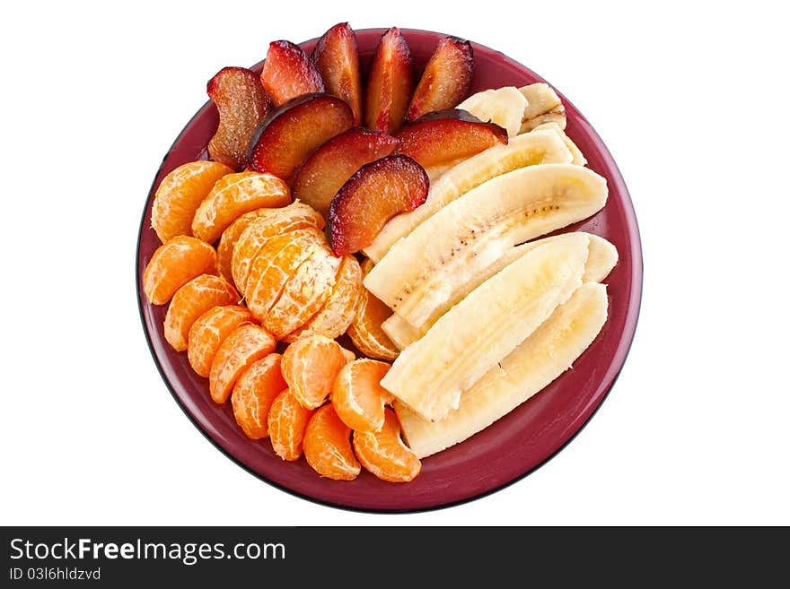 Fruits on dish, mandarine, banana and blumbs, isolated on white. Fruits on dish, mandarine, banana and blumbs, isolated on white.