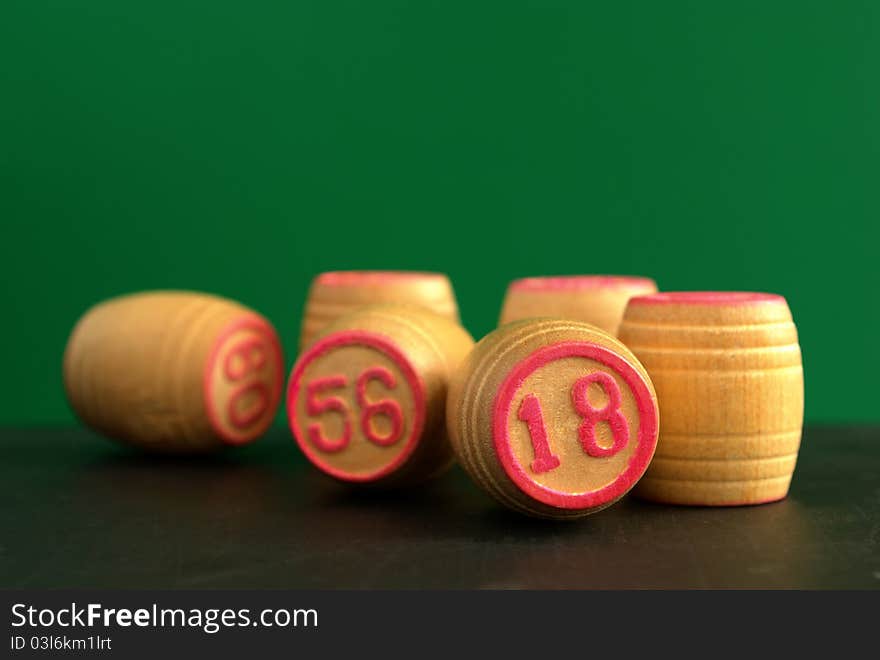 Wooden barrels with lotto games in red digits