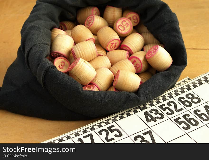 Wooden barrels with lotto games in red digits