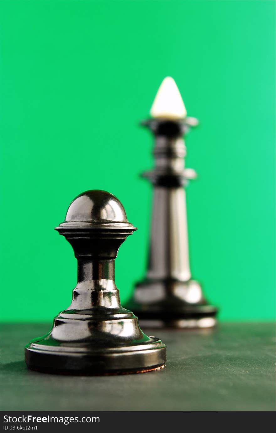 Chess pieces, pawn and a king