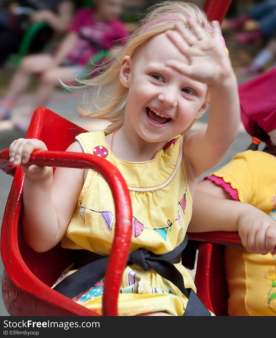 Little happy girl at the summer park