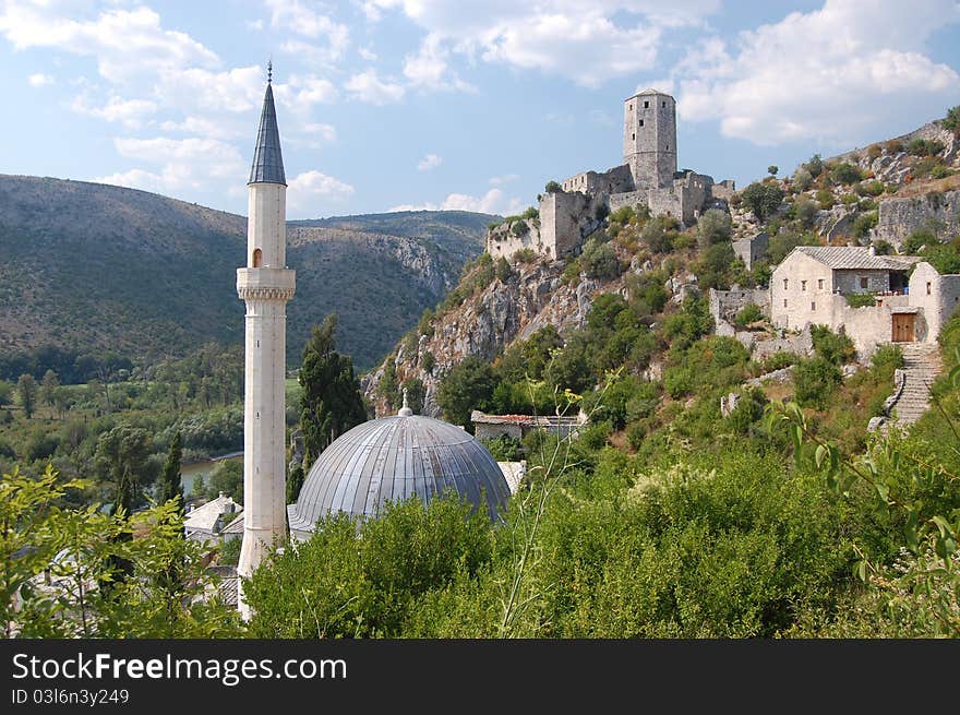 A photograph Pocitelj Town on the Capljina River with mosque and castle, Bosnia and Herzegovina. A photograph Pocitelj Town on the Capljina River with mosque and castle, Bosnia and Herzegovina