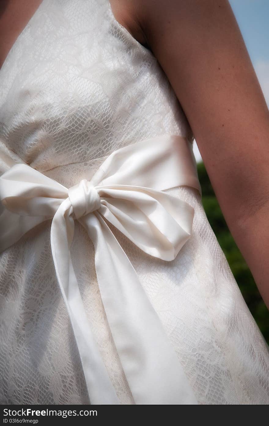 Brides dress with bow from front close up