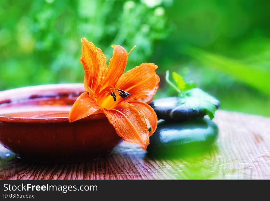 Still life with lily flower and spa stones. soft focus. Still life with lily flower and spa stones. soft focus