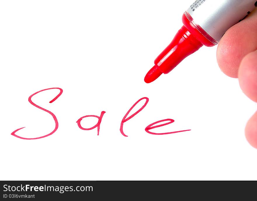 Hand with marker writing Sale isolated on white background