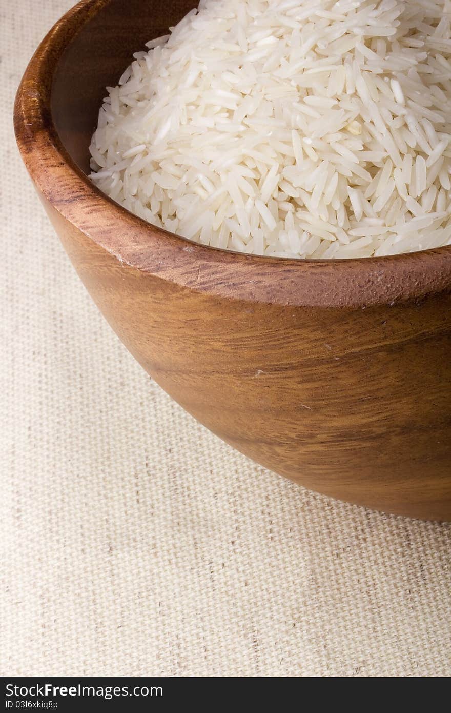 Close-up of white rice in a brown plate.