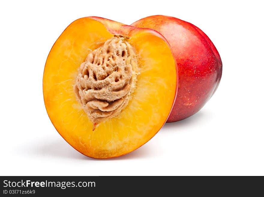 Two nectarines on a white