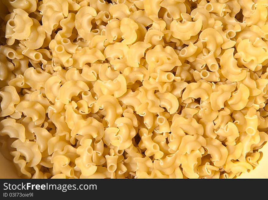 Irregular Shaped Dry Yellow Pasta in a Bowl