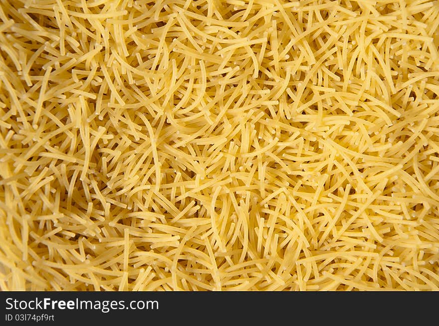 Dry Yellow Short Vermicelli Pasta Background. Dry Yellow Short Vermicelli Pasta Background