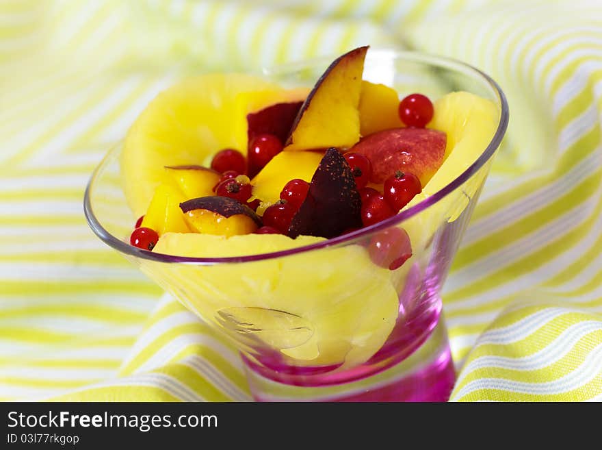 Fresh fruit salad served in bowl as dessert. Fresh fruit salad served in bowl as dessert.