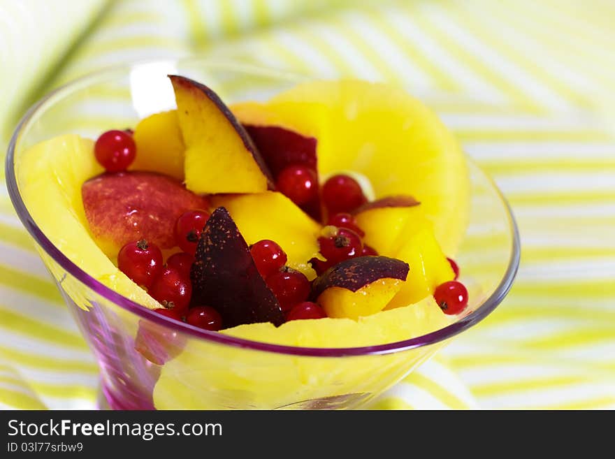 Fresh fruit salad served in bowl as dessert. Fresh fruit salad served in bowl as dessert.