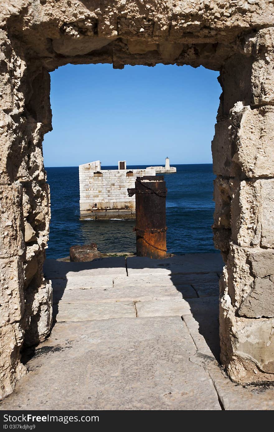 The breakwater protecting the Grand Harbour, Valletta, Malta the bridge of which was destroyed during an attack by the axis forces in the second world. The breakwater protecting the Grand Harbour, Valletta, Malta the bridge of which was destroyed during an attack by the axis forces in the second world.